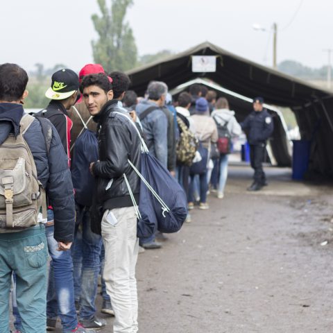 Sid, Serbia - October 17, 2015: Refugees waiting to cross the Serbo-Croatian border between the cities of Sid (Serbia) and Bapska (Croatia).